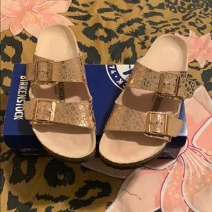 Worn once Birkenstock. Size 9. Gold snake skin.